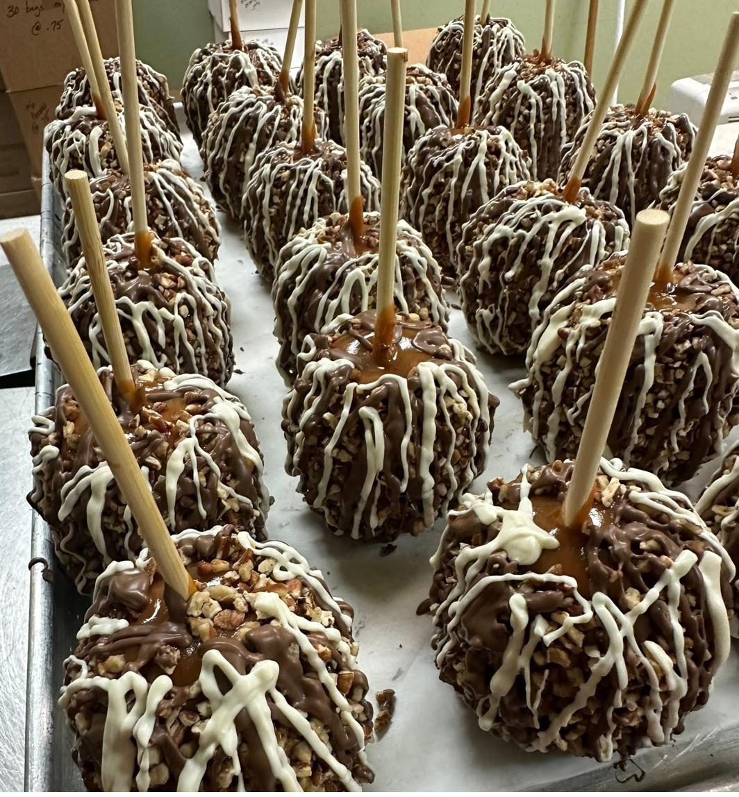 Caramel apples drizzled with milk and white chocolate